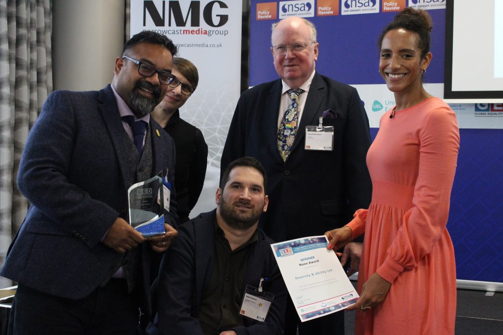 Chief Executive Atif Choudhury and Adam Hyland, Director of Campaigns at Diversity and Ability Ltd receive the 2018 Noon Award.